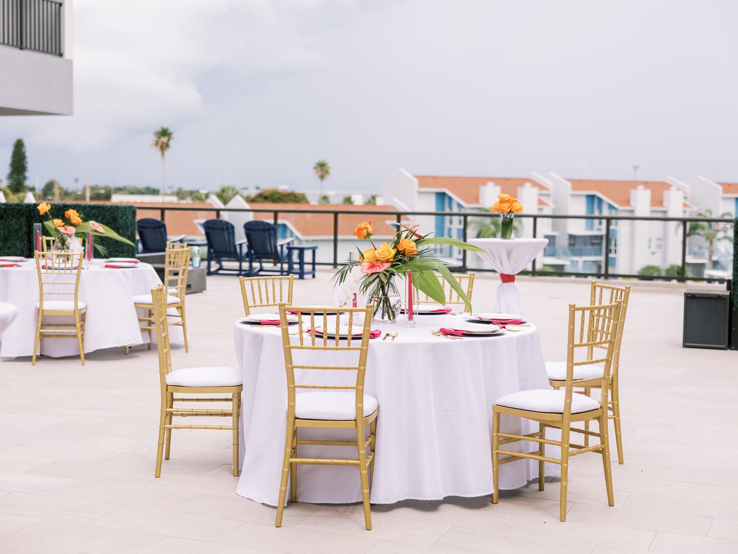 Outdoor Event Setup with Tables and Chairs on a Terrace