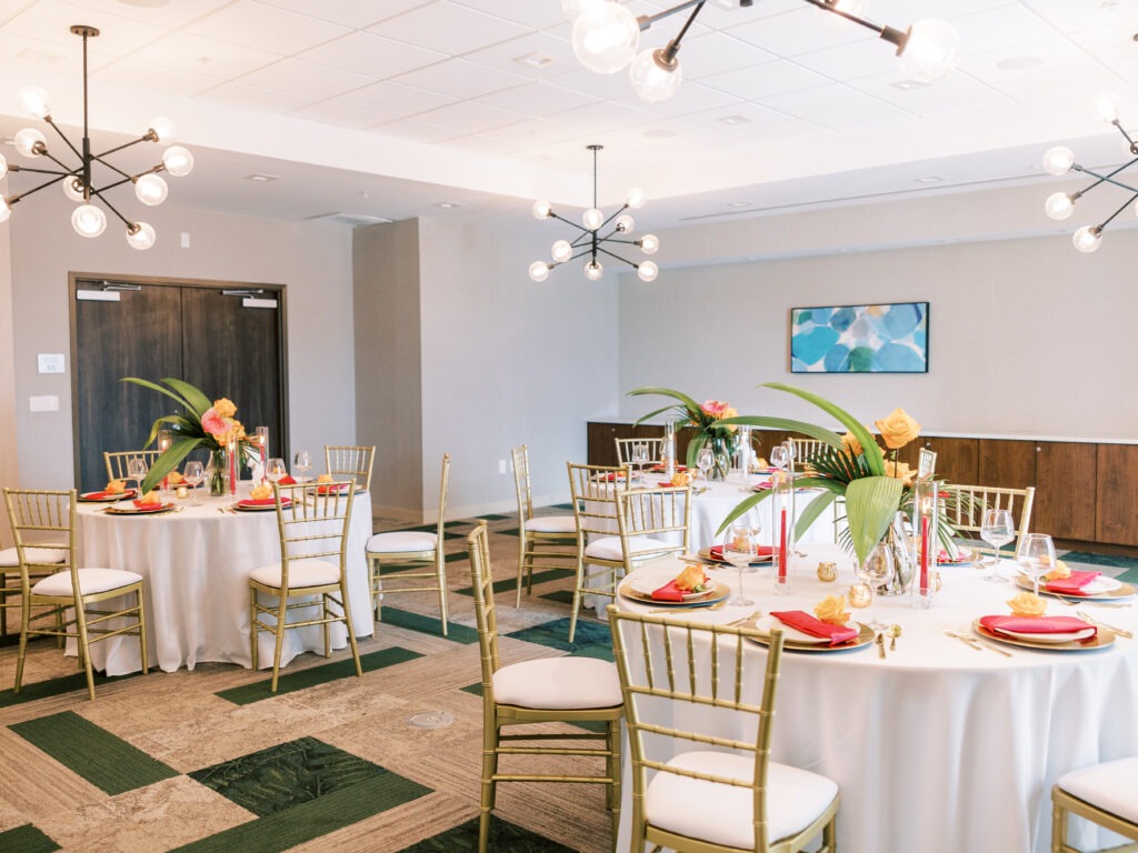 Elegant Indoor Event Setup with Decorated Round Tables