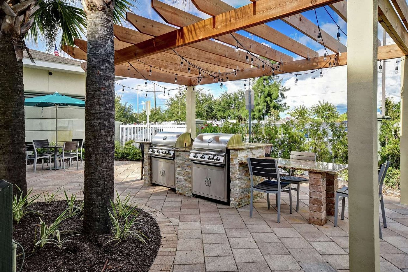 Outdoor Grilling Station Under Wooden Pergola